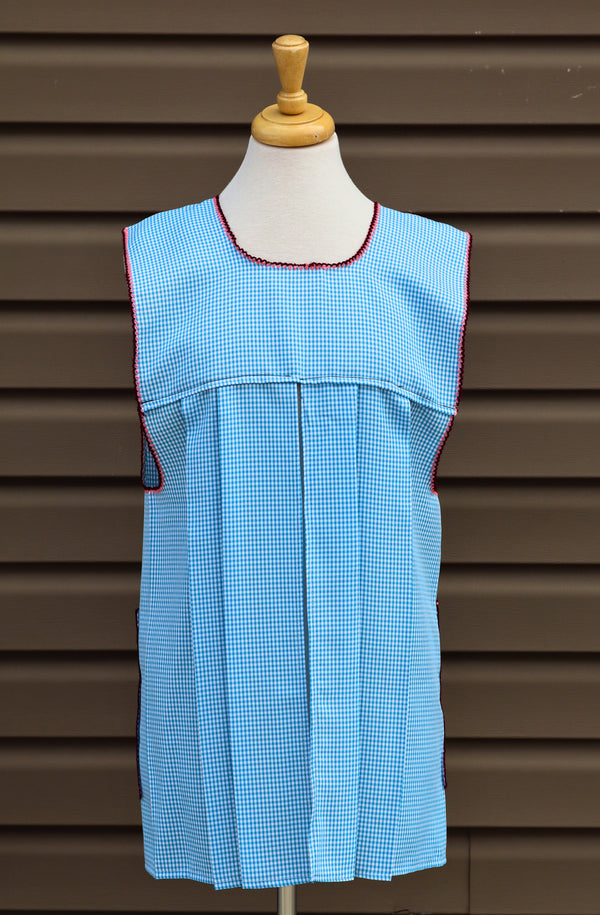 Back view of baby blue gingham Mexican apron showing the open-back design