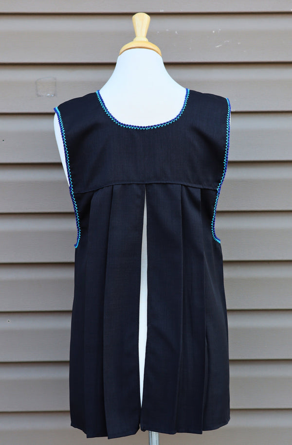 Back view of black Mexican apron showing the open-back design