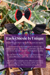 A black baby bodysuit with colorful floral embroidery, hanging on a wooden hanger with a matching white bow headband. The background features lush green houseplant leaves, and a large purple text box overlays the lower half with information about customization.