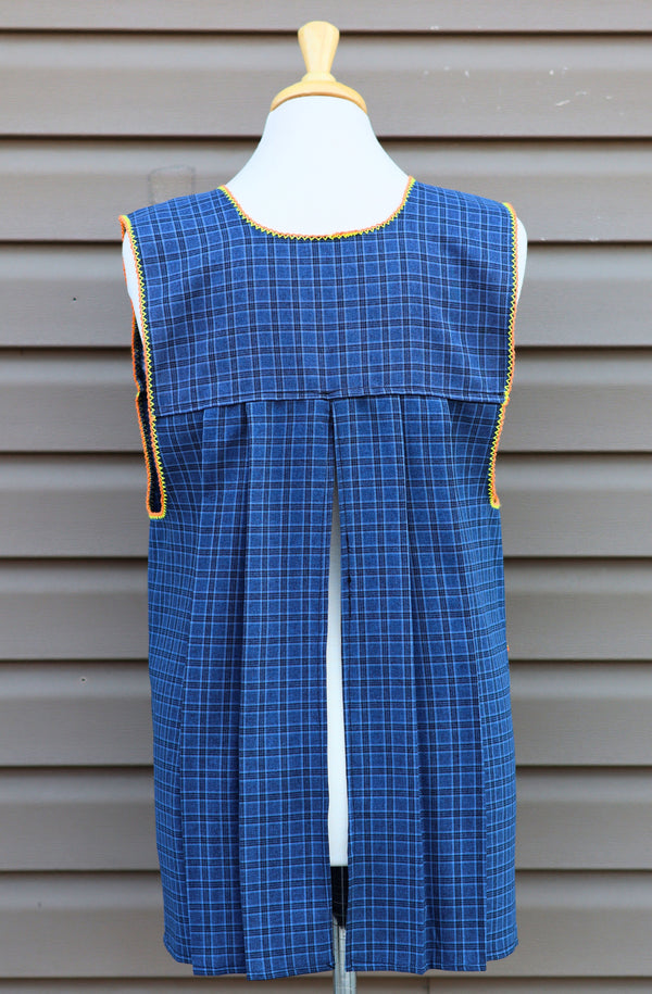 Back view of blue plaid Mexican apron showing the open-back design