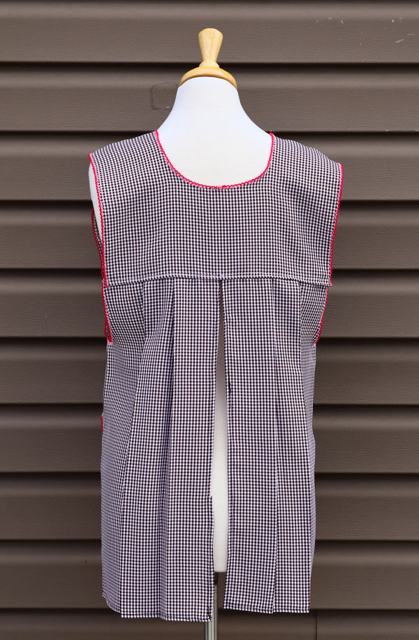Back view of brown gingham Mexican apron showing the open-back design