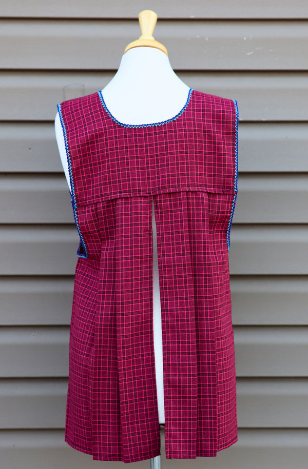 Back view of burgundy plaid Mexican apron showing the open-back design