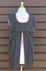 Back view of gray plaid Mexican apron showing the open-back design