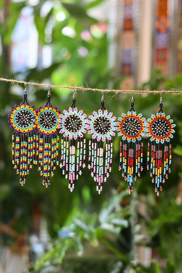 Assorted sunburst seed bead earrings handcrafted in Mexico.