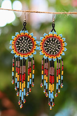 Blue sunburst seed bead earrings handcrafted in Mexico.
