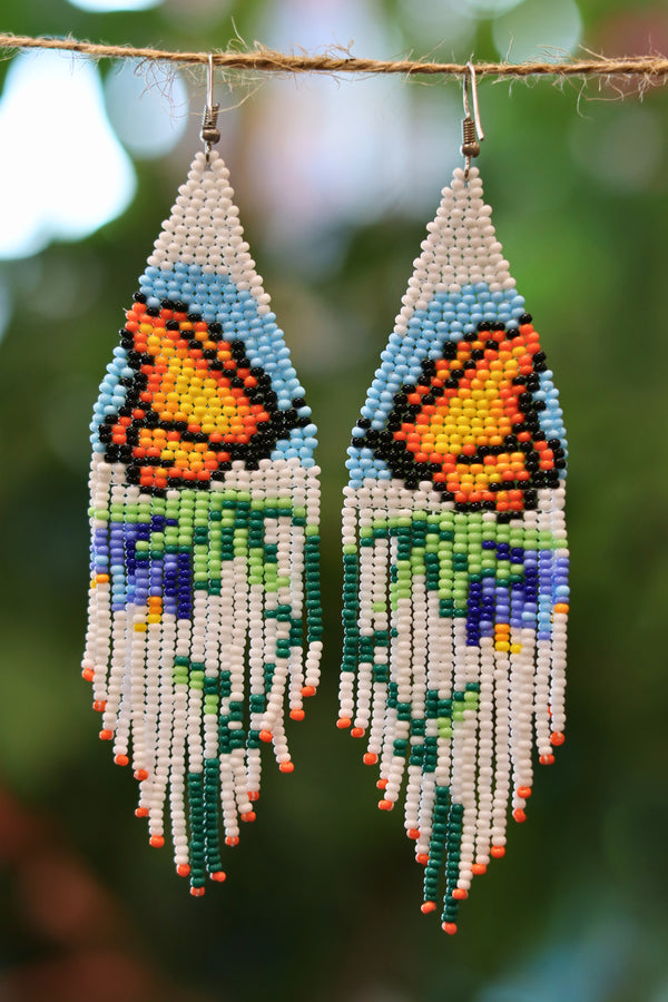 Handmade Monarch butterfly beaded earrings handcrafted by artisan families in Mexico.