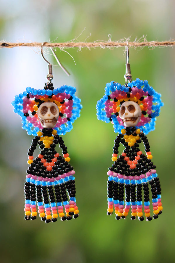 Front view of blue Catrina seed bead earrings handcrafted in Mexico.