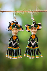 Front view of green Catrina seed bead earrings handcrafted in Mexico.