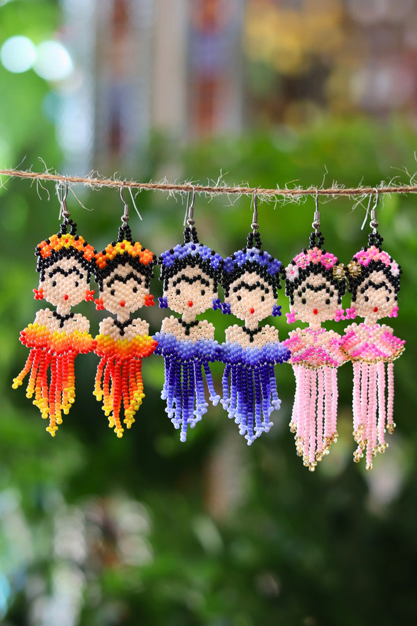 Assorted Frida-inspired seed bead earrings handcrafted in Mexico.
