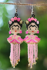 Pink Frida-inspired seed bead earrings handcrafted in Mexico.