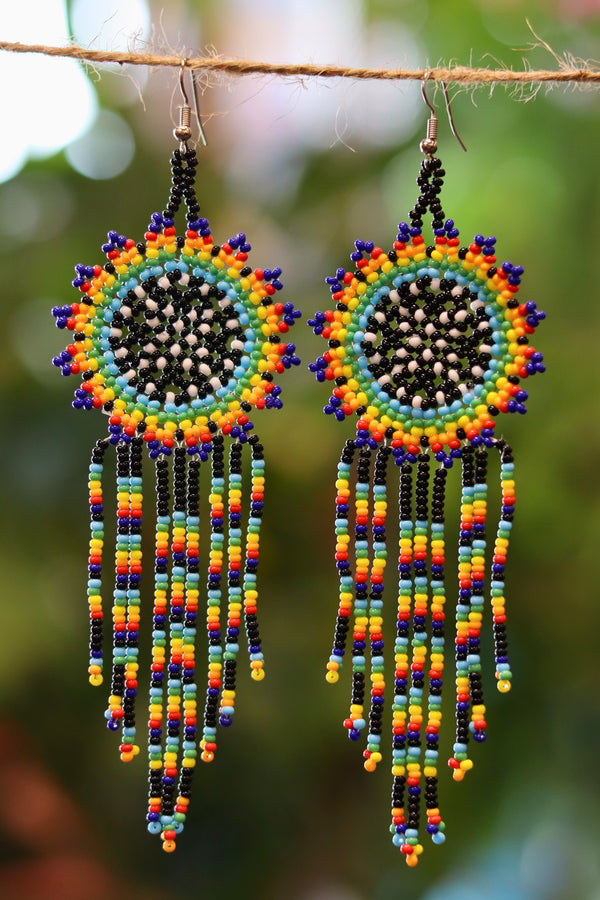 Rainbow sunburst seed bead earrings handcrafted in Mexico.