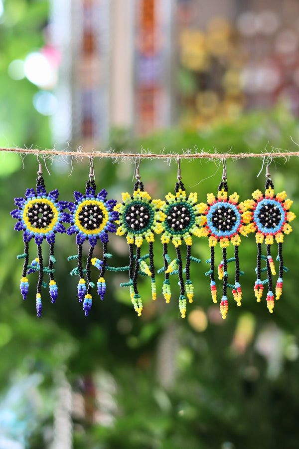Assorted sun dreamcatcher seed bead earrings handcrafted in Mexico.