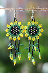 Green sun dreamcatcher seed bead earrings handcrafted in Mexico.