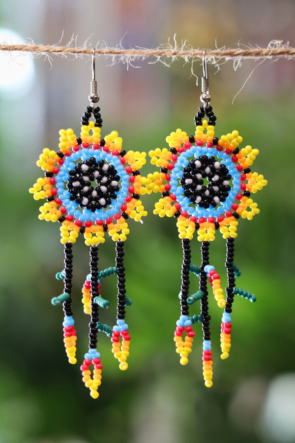 Yellow sun dreamcatcher seed bead earrings handcrafted in Mexico.