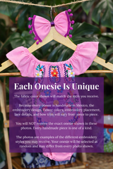 A pink baby bodysuit with colorful floral embroidery, hanging on a wooden hanger with a matching white bow headband. The background features lush green houseplant leaves, and a large purple text box overlays the lower half with information about customization.