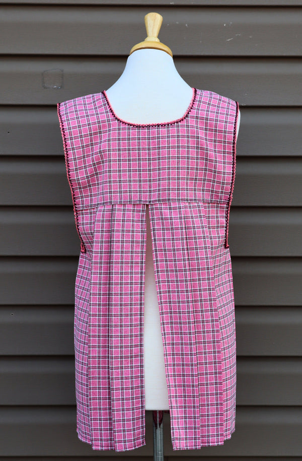 Back view of pink plaid Mexican apron showing the open-back design