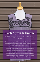 Purple gingham Mexican apron with colorful cross-stitch embroidery, front pockets, and a handmade variation disclaimer