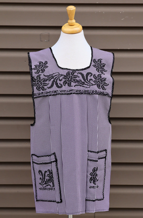 Purple gingham Mexican apron with colorful cross-stitch embroidery and front pockets
