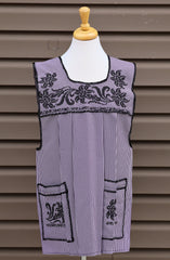 Purple gingham Mexican apron with colorful cross-stitch embroidery and front pockets