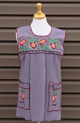 Purple gingham Mexican apron with colorful cross-stitch embroidery and front pockets